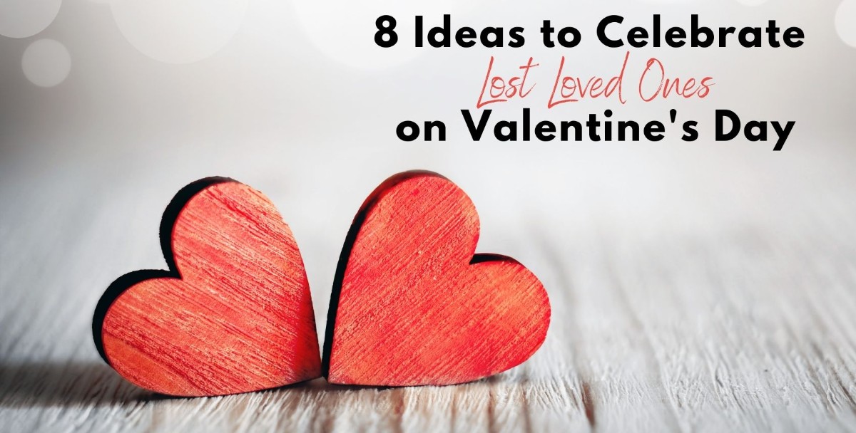 Two red wooden hearts sitting on table. Text overlay: "8 Ideas to Celebrate Lost Loved Ones on Valentine's Day".
