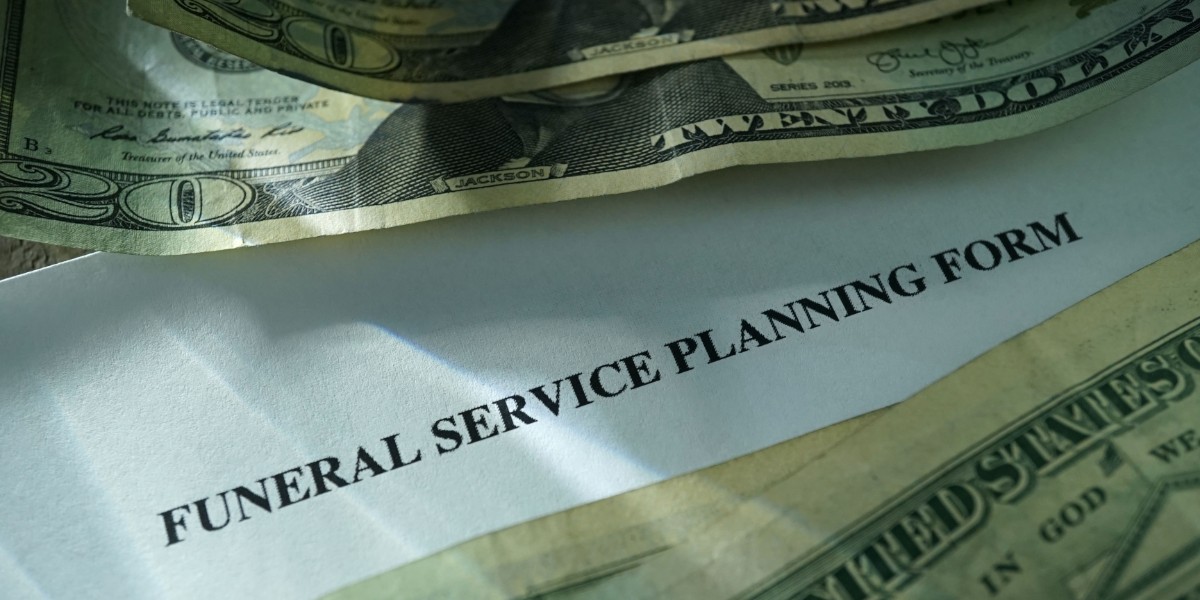 US $20 bill sitting above white paper titled "Funeral Service Planning Form".