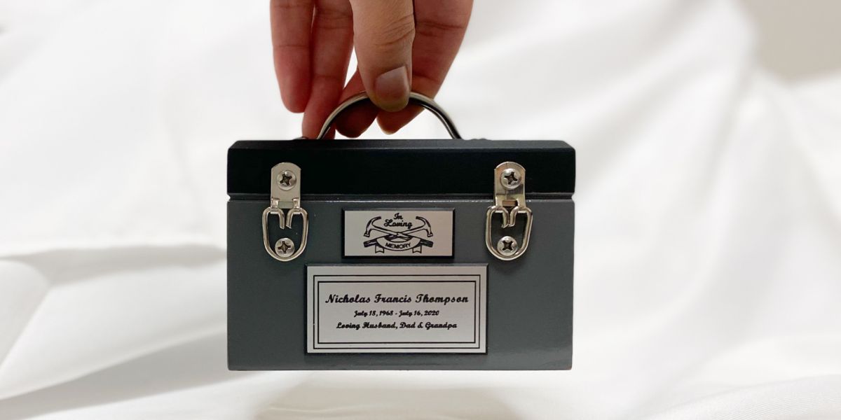 Mini briefcase keepsake urn for cremation ashes.