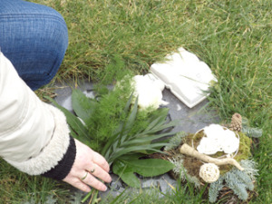 Woman performing green burial memorial.