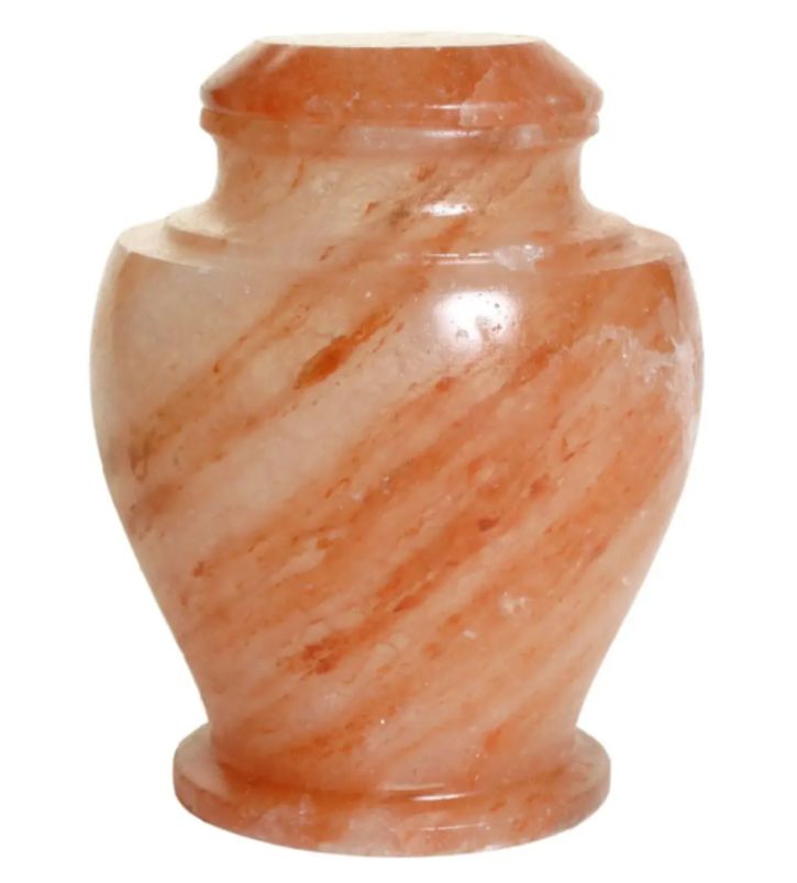 This urn is carved out of salt from the Magnificent Mountains of the Himalayas where Mother Nature has been compacting salt crystals for many millennia. The reddish hue of the salt is derived from the iron content in the salt bed.