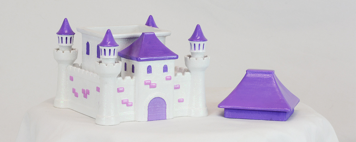 The 3D-printed princess castle custom cremation urn with the main roof removed to show the compartment for inserting ashes.