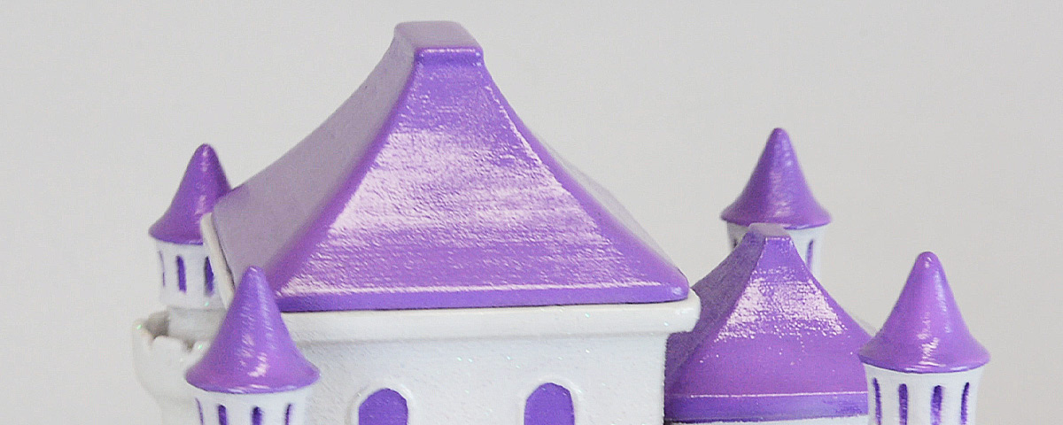 A close-up of the purple roofs of the 3D-printed princess castle urn.