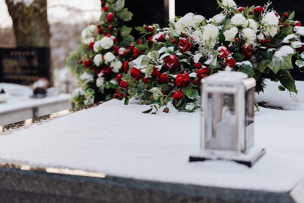 Snow covered memorial for cremation remains.