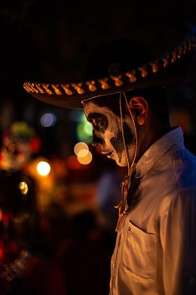 Man with painted face celebrating Dia de los Muertos.