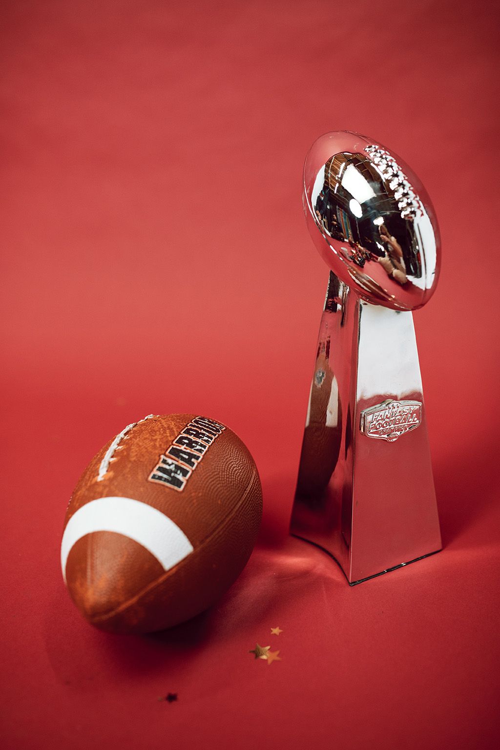 Miniature Lombardi trophy and football.