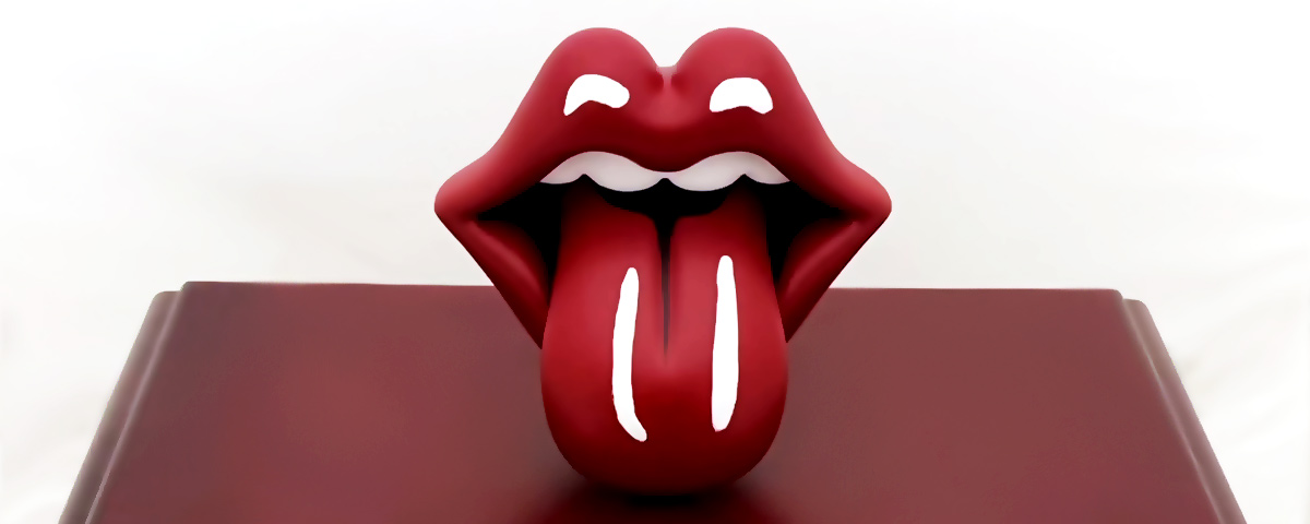 A 3D-printed model of the Rolling Stones' tongue and lips design on top of a wooden urn.